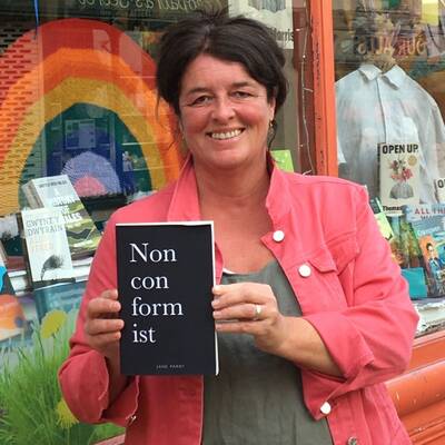 Jane Parry with her book Nonconformist outside Palas Print bookshop in Caernarfon