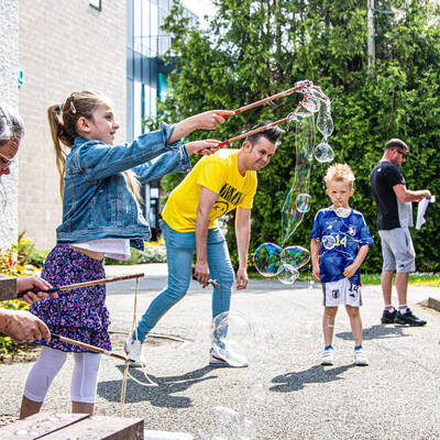 A girl playing with bubbles at the Llangefni Community Fun Day in 2023